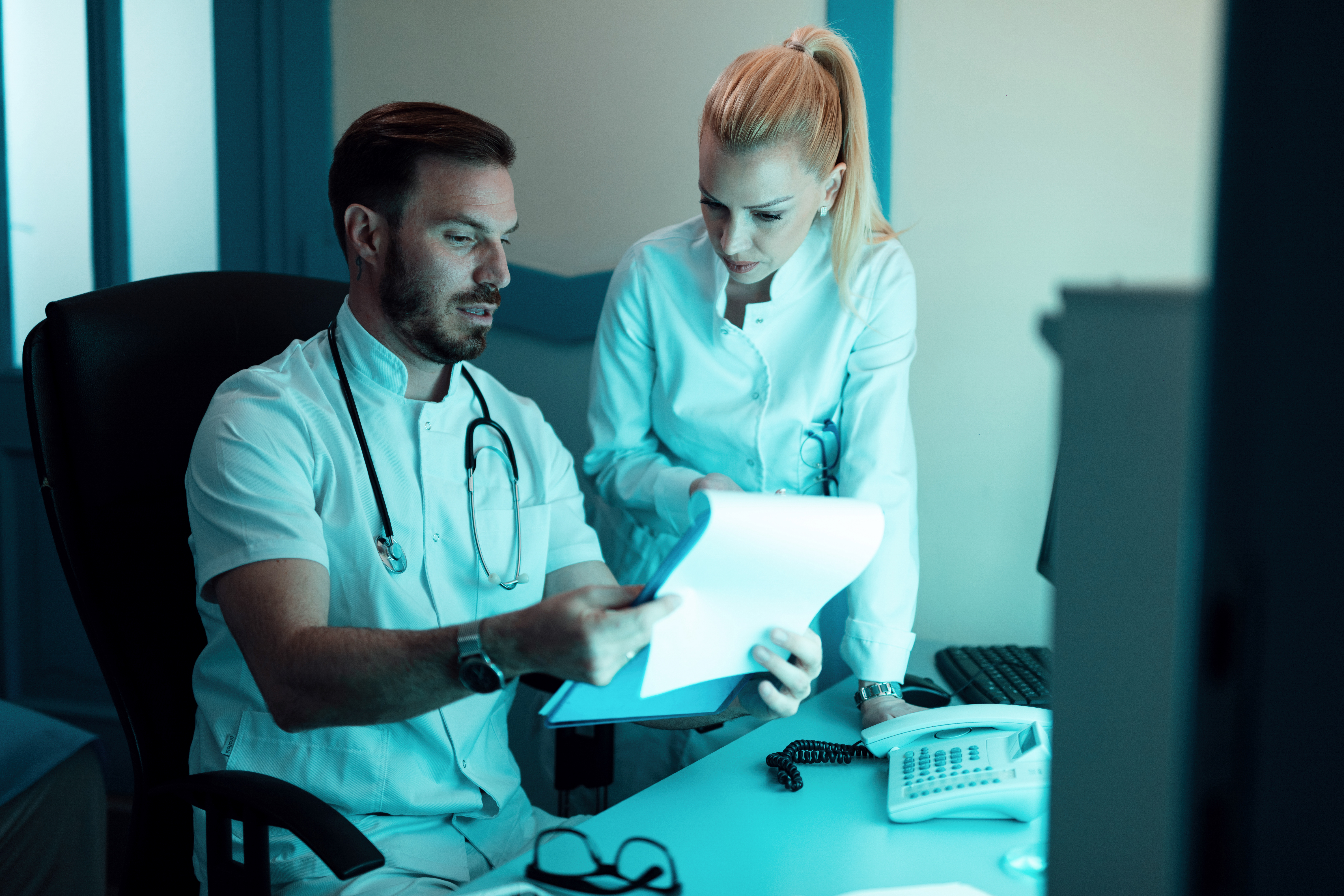 Healthcare professionals reviewing revenue data together
